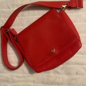 Vibrant Red Crossbody Bag with Textured Material and Long Strap